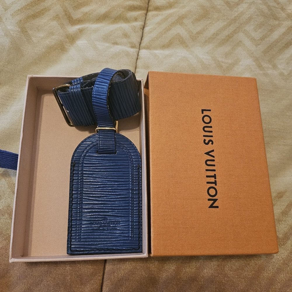 Authentic Louis Vuitton epi blue Luggage tag and poignet set with box.